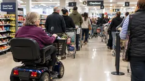 Mobility Scooter in the Checkout Queue
